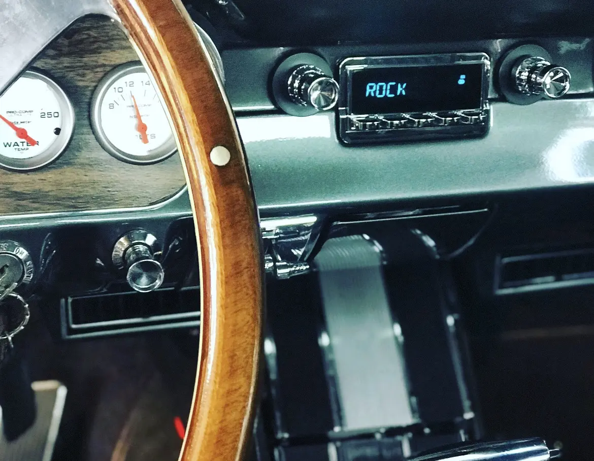 A close up of the steering wheel and dashboard